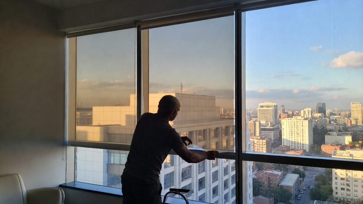 person installing commercial window film image